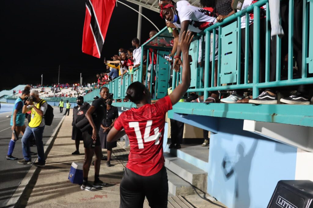 Trinidad and Tobago captain Karyn Forbes interacts with a fan after a 2-2 draw with Guyana at the Dwight Yorke Stadium, Bacolet, Tuesday.  Photo source: Shamfa Cudjoe FB page 