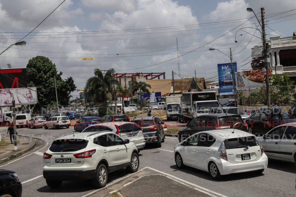 File photo: Drivers try to navigate the gridlock traffic at the Roxy roundabout in St James on Thursday as WASA workers repaired a broken water line on the Western Main Road in Cocorite. Photo by Jeff K Mayers
