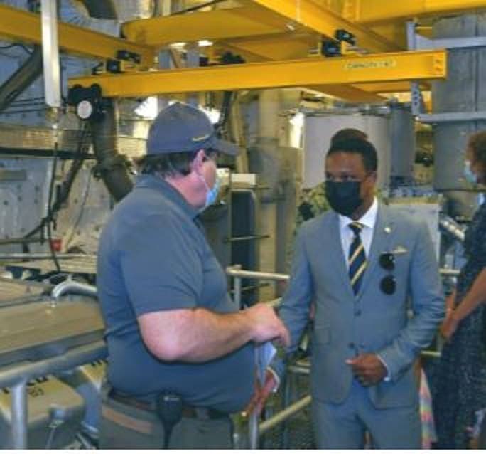 Foreign and Caricom Affairs Minister Dr Amery Browne (right) talks with a crew member on board the USNS Burlington in Port of Spain on April 14. -  Photo courtesy Ministry of Foreign Affairs