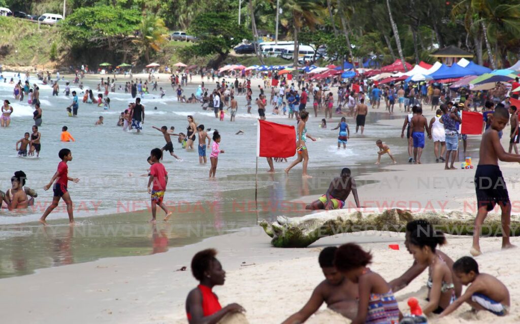 Maracas beach is filled with people and activity on Easter Sunday. - ROGER JACOB