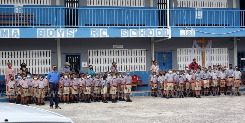 Students and teachers at assembly, the first in two years, at the Arima Boys’ RC School on Tuesday morning.  - ROGER JACOB
