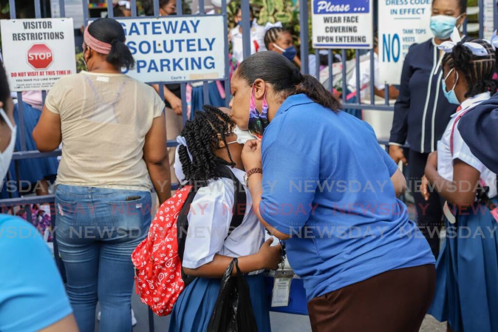 Mother's Love, 
Melissa Oliver expressed to Newsday, how happy she felt to have her daughter Ruby, nine year old standard three pupil of Sacred Heart Girls' R. C. School out of the house on Tuesday. Photo by Jeff Mayers