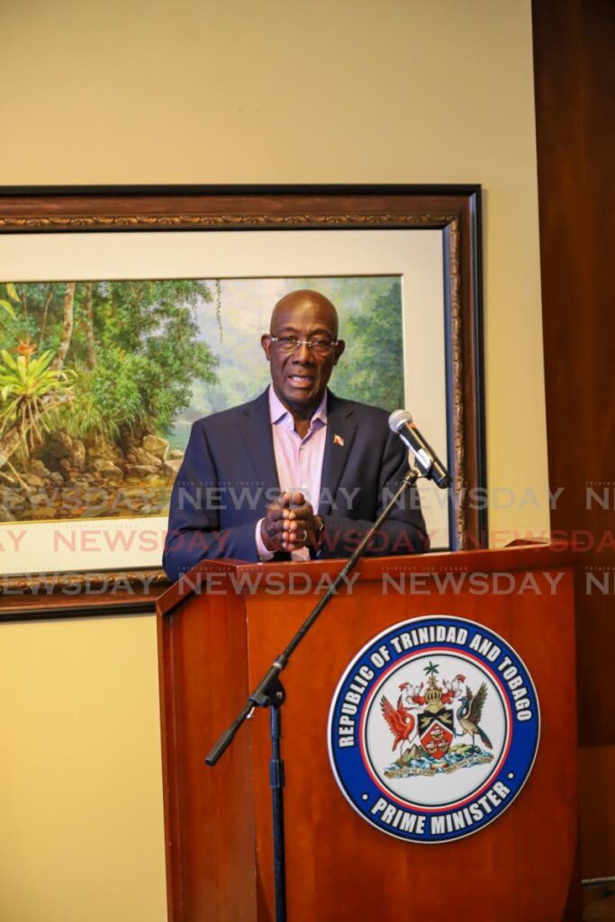 Prime Minister Dr Keith Rowley addresses the media after his return from Barbados at the VIP Lounge, Piarco International Airport on Thursday. Photo by Jeff K. Mayers 
