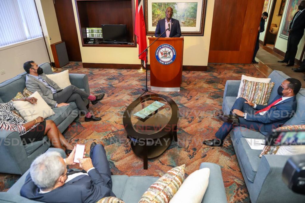 Prime Minister Dr Keith Rowley addresses government ministers and the media after his return from Barbados at the VIP Lounge, Piarco International Airport on Thursday. - Jeff K. Mayers 