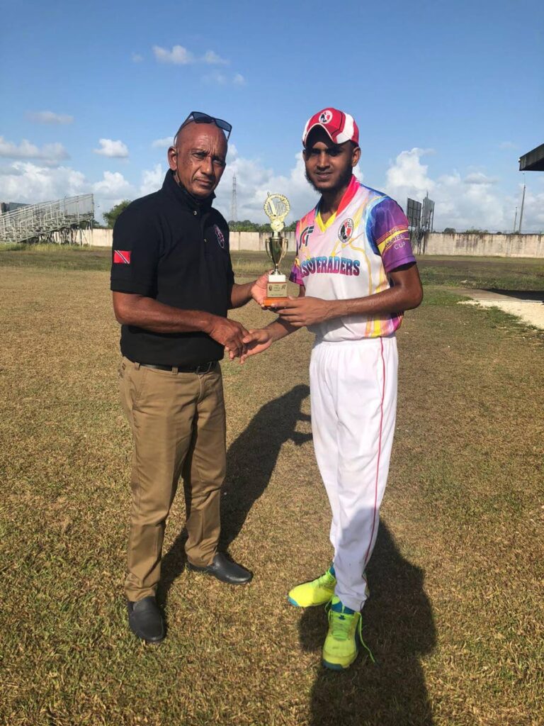 Verran Batchu of Masqueraders, right, collects the man of the match award in the second round fixture of the Sports and Culture Fund Under-19 Cup cricket tournament from Parasram Singh, third vice-president of the TT Cricket Board. - TTCB