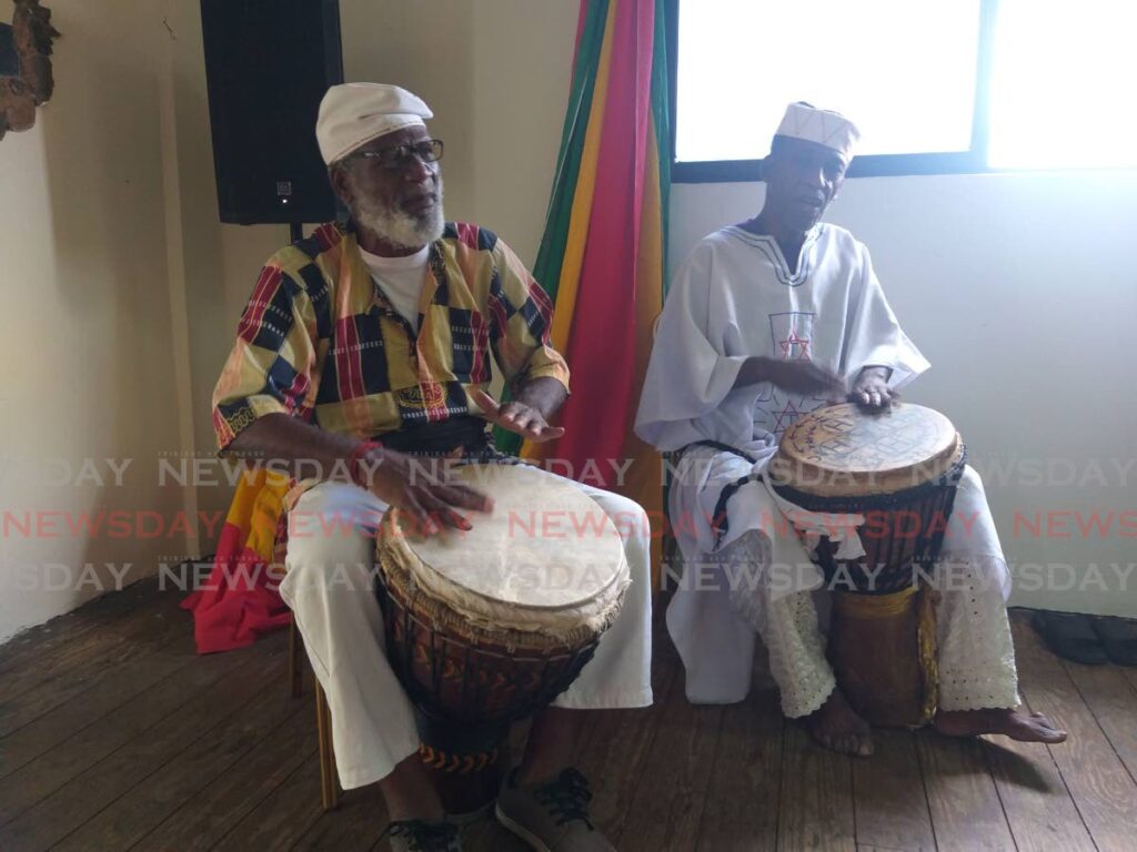 Drummers play traditional Orisha hymns during Saturday's celebrations at the Pamberi Steel Orchestra Pan Yard, San Juan, to commemorate the 52nd anniversary of Basil Daviss death.   - Tyrell Gittens