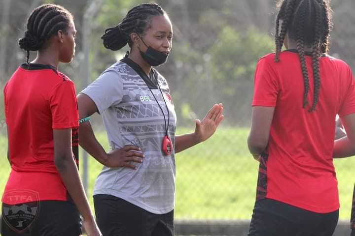 TT Under-17 women’s assistant coach Dernelle Mascall (C),speaks with some of her players ahead of their opening match of the Concacaf U-17 Women’s Championship against Panama in Santo Domingo, on Saturday. - TTFA Media