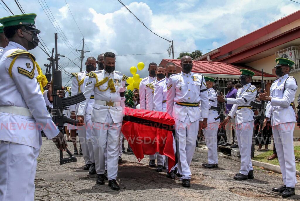 Pallbearers carry the body of  Junior Chase at His Holiness Holy Sanctuary, Market Road, Fyzabad. Chase was shot and killed earlier this month on Cipero Street in San Fernando. - AYANNA KINSALE