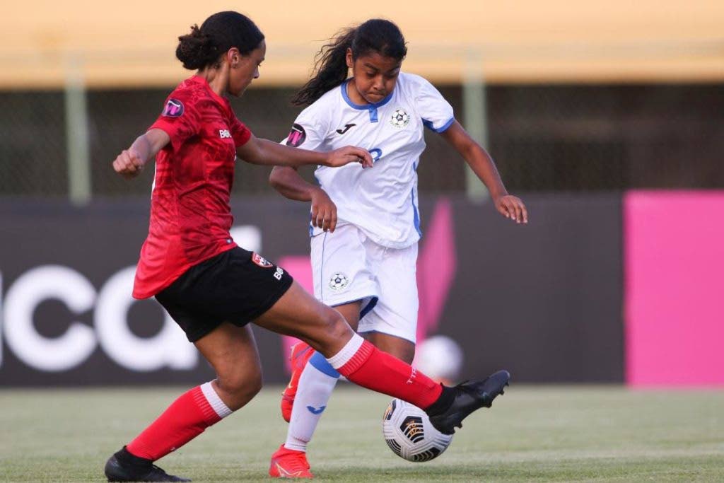 A Trinidad and Tobago player tackles her Nicaraguan opponent in a Concacaf Under 17 Women's Championship match. Photo courtesy Concacaf  - 