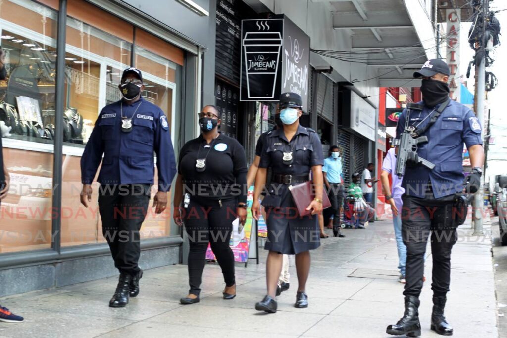 In this file photo, Port of Spain City Corporation officers on patrol downtown as part of the anti-crime measures in the city. Photo by Roger Jacob