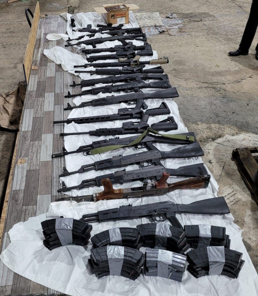 FILE PHOTO: Guns and ammunition seized by police at a warehouse in March. The 2020 Strategic Services Agency report claims that some of the weapons, including high-powered rifles, seized by police are findin their way back to the hands of criminals. - TTPS