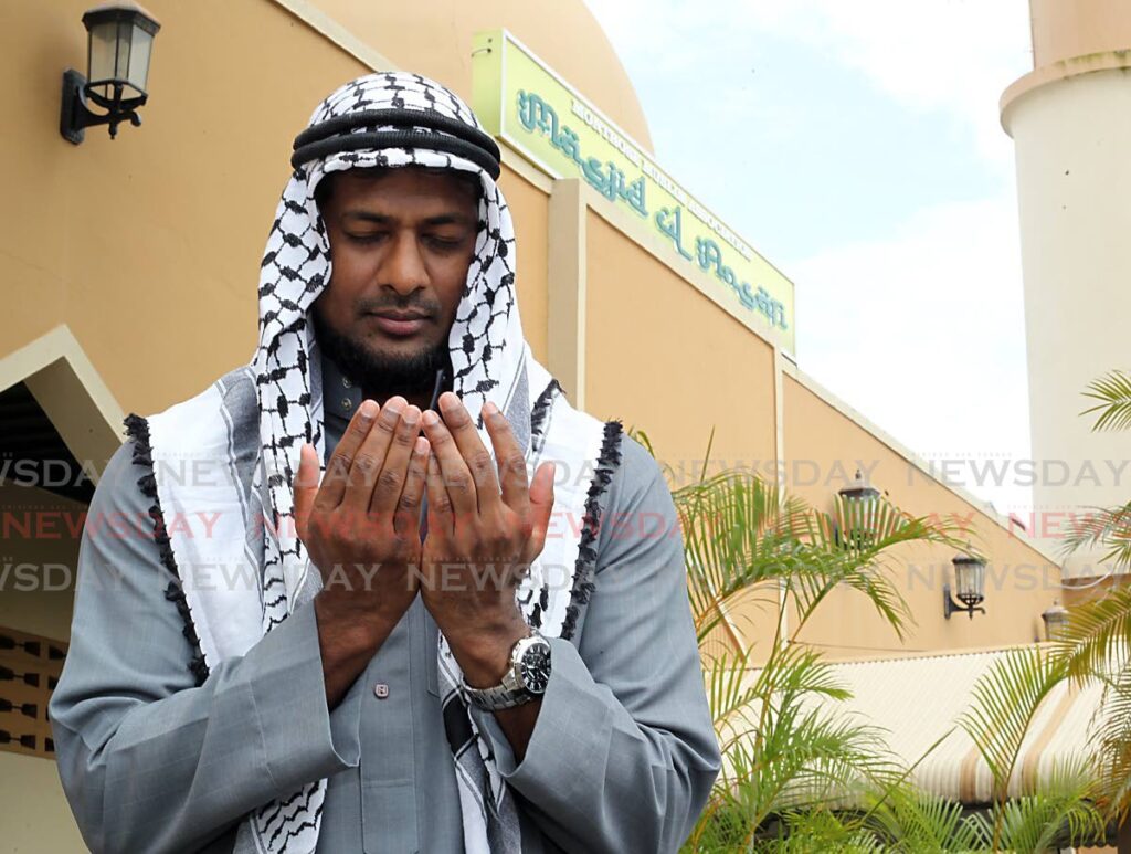 Tyrel Basdeo in prayer at the
Masjid-ul-Ansari, Montrose Masjid in Chaguanas. Photo by Roger Jacob