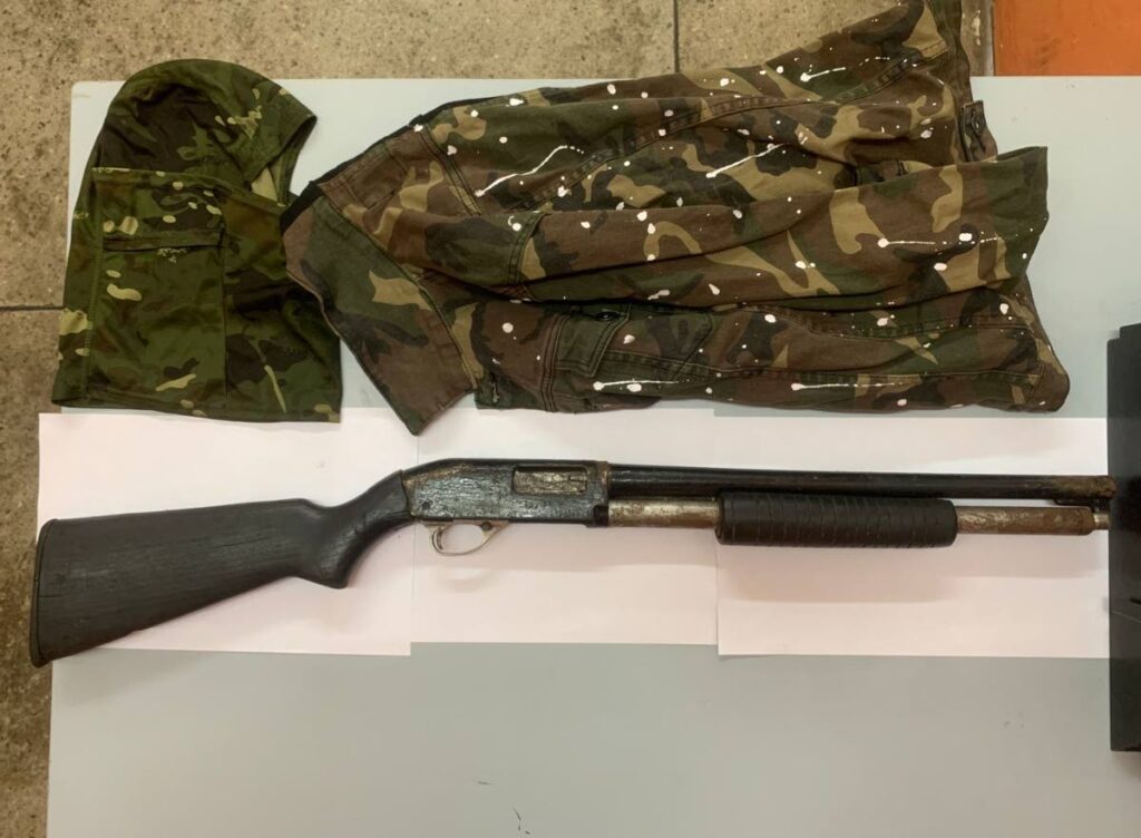 A 12 gauge shotgun and camouflage clothing were seized by police during an anti-crime exercise in Morvant on Sunday. 

PHOTO COURTESY TTPS - 