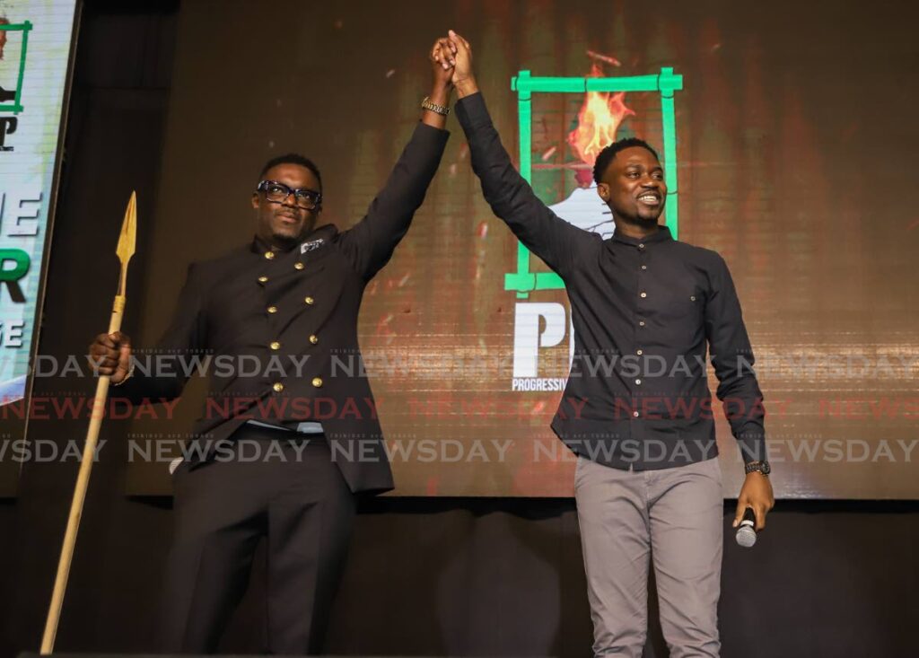 PDP political leader Watson Duke, left, and THA Chief Secretary Farley Augustine at the launch of the PDP's Trinidad arm on Sunday at the Hyatt Regency.  File photo/Jeff K Mayers