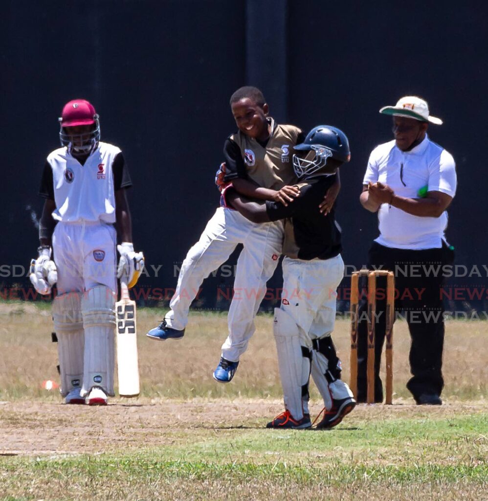 Tobago’s Ajani Noel (C )is lifted in the air by a teammate after dismissing North’s Abdiel Boland in the round one match of the Scotibank NexGen U13 tournament, at Shaw Park, Tobago, on Wednesday.  Photo by David Reid