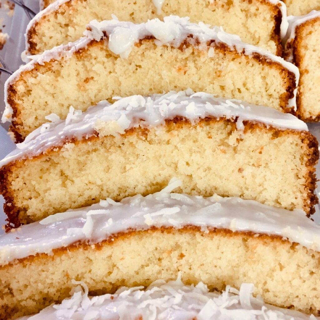 White coconut cake with fluffy white frosting - Wendy Rahamut