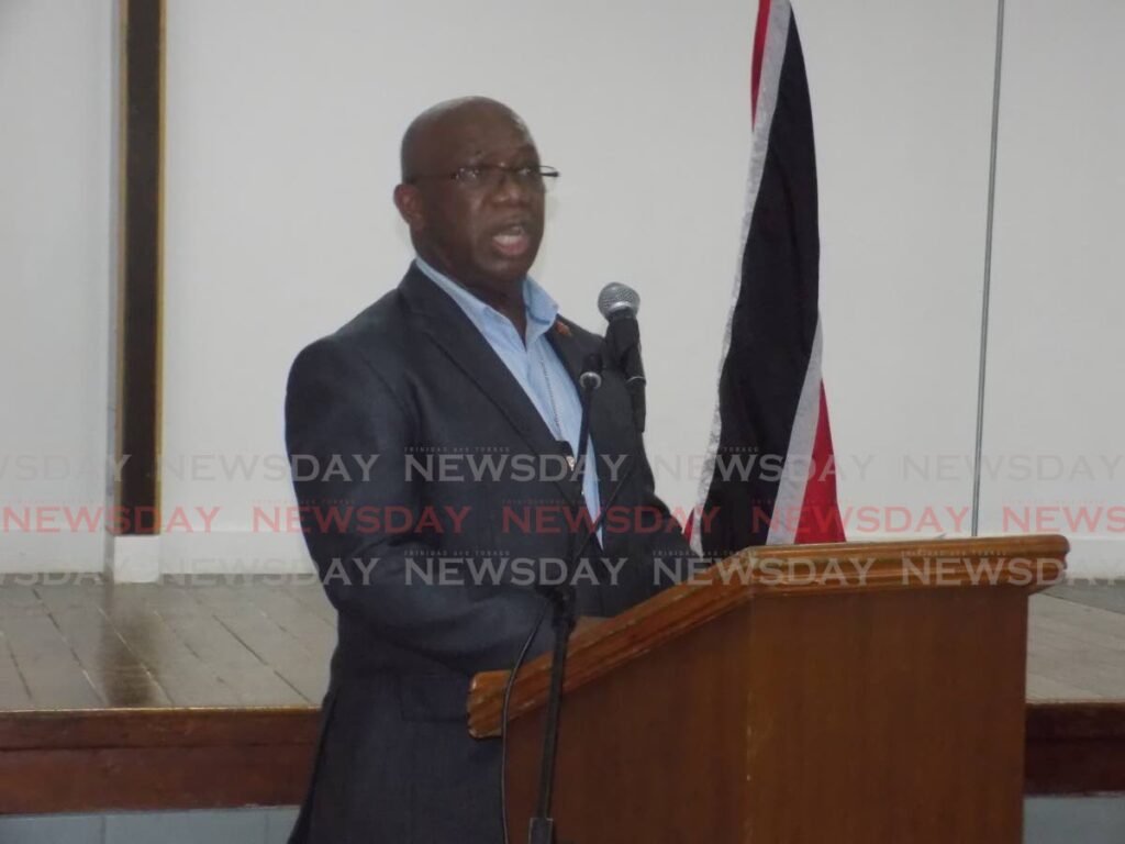 Acting Police Commissioner McDonald Jacob speaks during a town hall meeting at the St Joseph community centre on Thursday evening.  Photo by Shane Superville