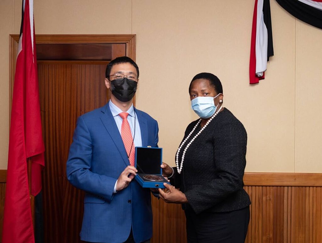 Minister of Planning and Development Pennelope Beckles gets IdeaHub from Huawei's country manager Evan Zhouyu - Ministry of Planning and Development 