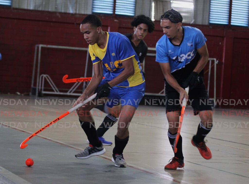 Action between Queen's Park and Fatima in the TT Hockey Board Indoor Festival at the Woodbrook Youth Facility. - ROGER JACOB