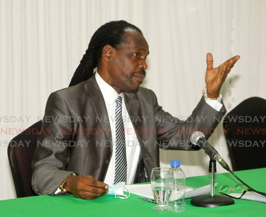 National Security Minister Fitzgerald Hinds gestures during Monday's news conference at his ministry in Port of Spain. Photo by Roger Jacob