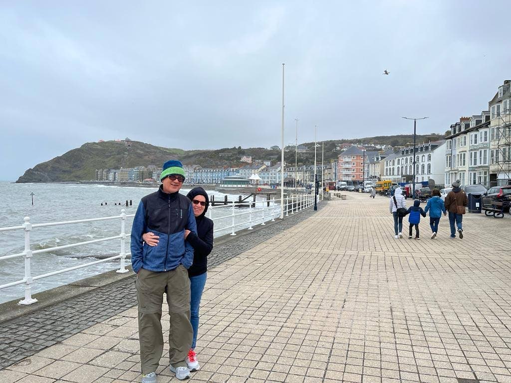  Jan Westmaas and wife on a promenade in Aberystywth, Wales. The town is tucked between Cambrian mountains and Cardigan Bay.  