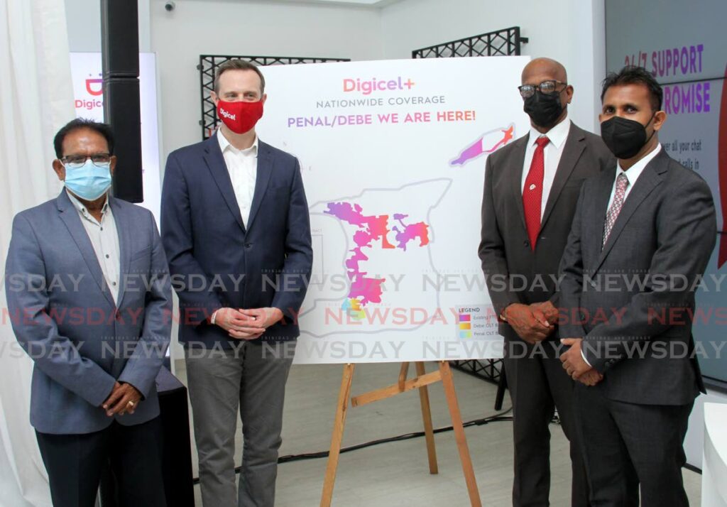 From left, immediate former past president of the Penal/Debe Chamber of Commerce Rampersad Sieuraj , CEO Abraham Smith, Mayor of San Fernando Junia Regrello and, General Manager of Digicel Plus+, Project Scope, Navin Balkissoon stand near the graph which shows new areas that would be provided with the Digicel+ services at Digicel experience store, C3 Mall, San Fernando. Photo by Ayanna Kinsale