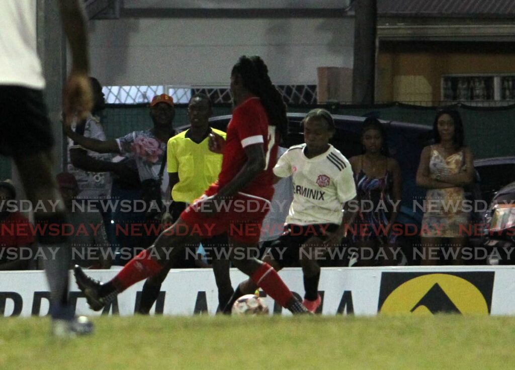 Terminix La Horquetta Rangers' Real Gill (right) scores his team's opening goal against Cunupia FC at the La Horquetta Recreation Ground, Arima on Friday. Photo by Roger Jacob