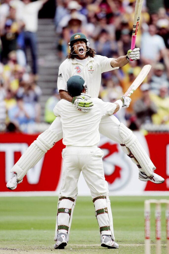 FILE: Australia's Andrew Symonds, back, jumps into the arms of his batting partner Matthew Hayden after Symonds made 100 runs against England at the Melbourne Cricket Ground in Melbourne, Australia on Dec. 27, 2006. Symonds died on Saturday, after a single-vehicle auto accident near Townsville in northeast Australia. He was 46. (AP Photo) 