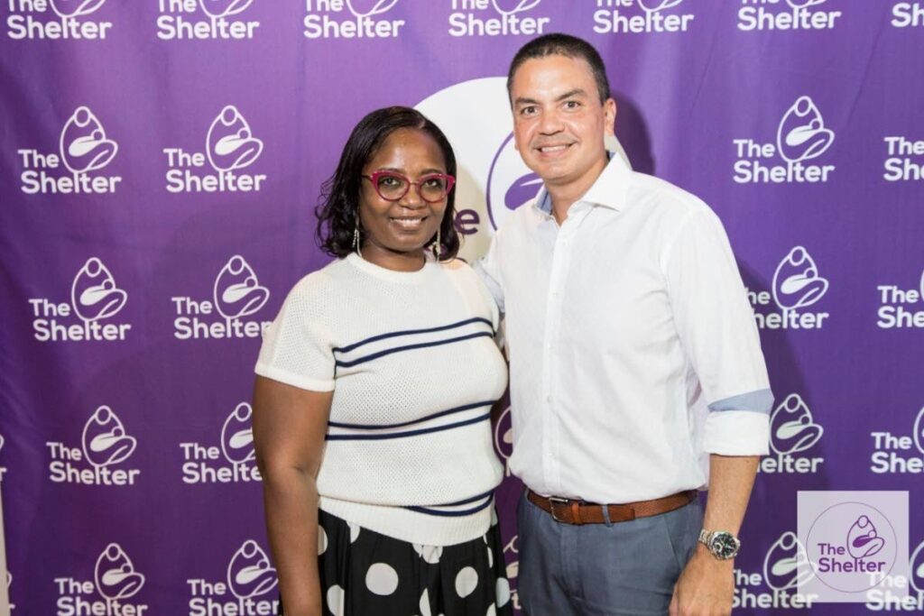 Yolande Agard-Simmons, senior manager, communications at Flow, left, with Colin Mitchell, chairman, The Shelter for Battered Women and Children. 