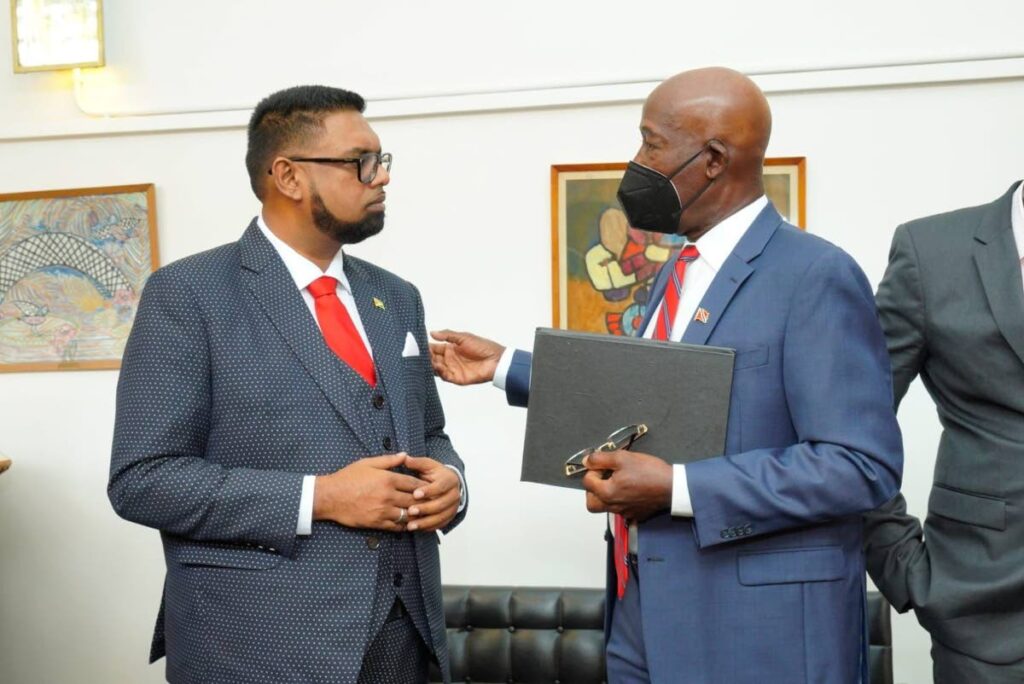 Prime Minister Dr Keith Rowley speaks with Guyana President Dr Irfaan Ali at the Caricom Agri Investment Forum and Expo in Guyana on Thursday. - Photo courtesy Office of the Prime Minister 