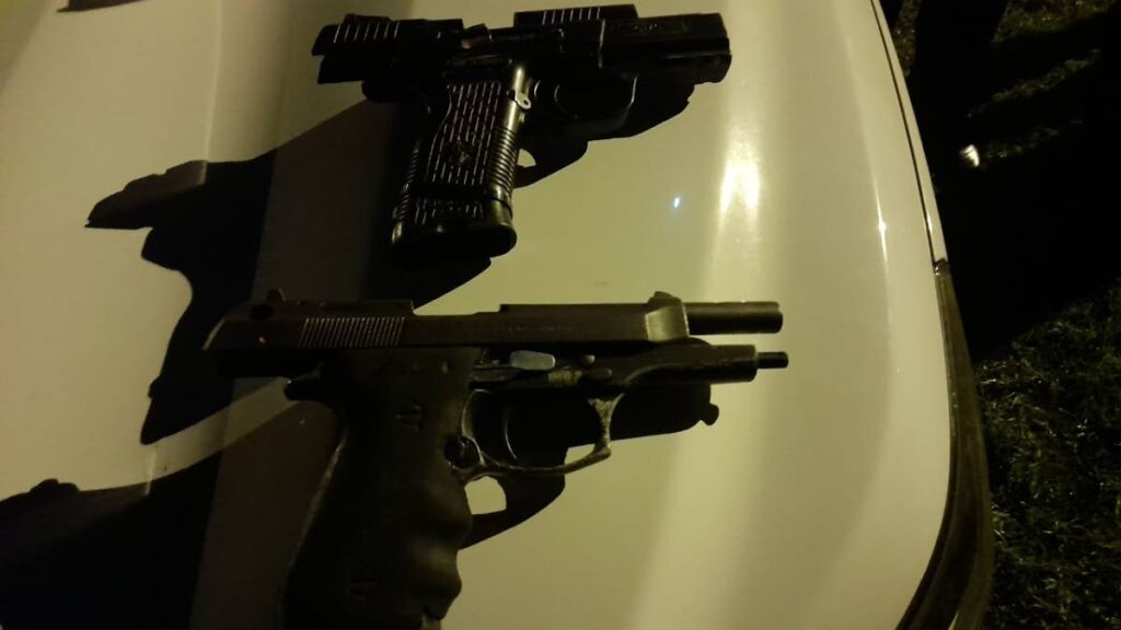 Two pistols were found and seized at a house in Cedros early on Friday morning. 
A 27-year-old Venezuelan man who was at home at the time was arrested.

PHOTO COURTESY TTPS - PHOTO COURTESY TTPS