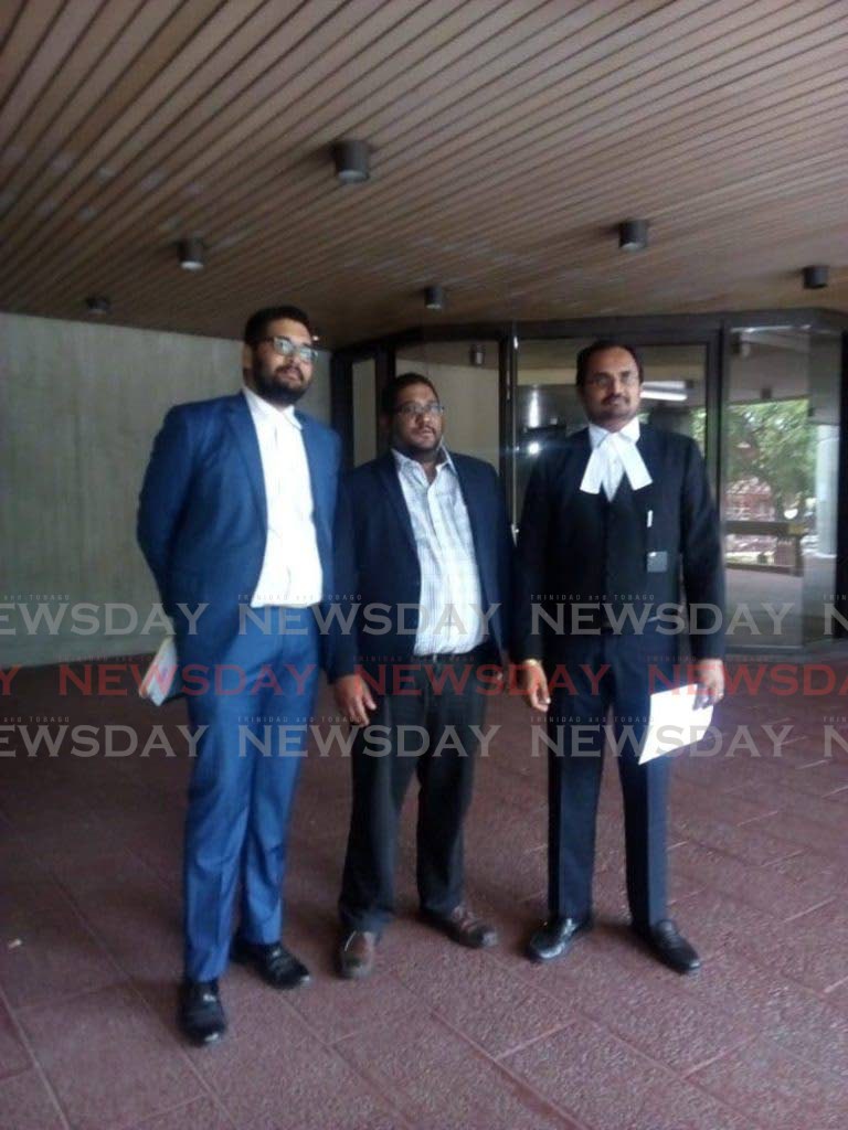 Lokesh Maharaj, CEO of Radio and TV Jaagriti, centre, with Central Broadcasting Services Ltd (CBSL) attorneys Stefan Ramkissoon, left, and Dinesh Rambally, right, at the Hall of Justice, Port of Spain. CBSL won its case against the Police Commissioner over a search warrant in 2019. - 