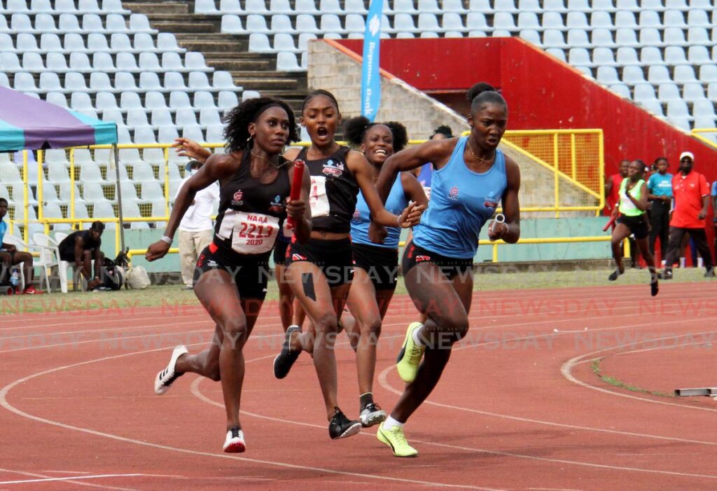 Athletes participate in the women's 4x100  relay during the Republic Bank/NAAA Relay Festival at the Hasely Crawford Stadium, Mucurapo on Sunday. - AYANNA KINSALE