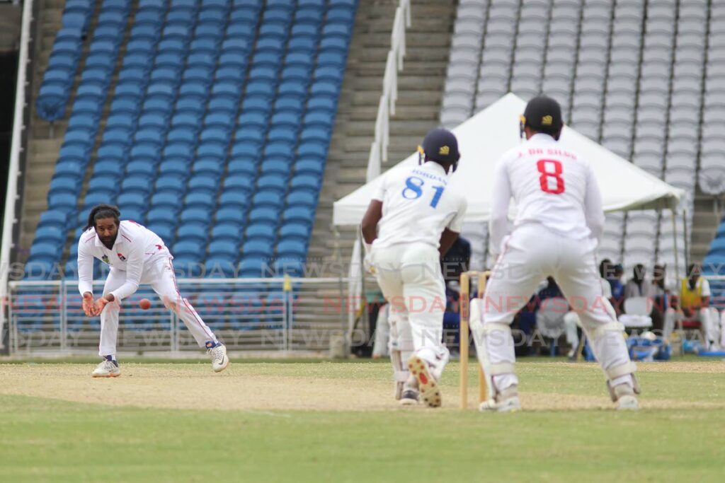 TT Red Force captain and leg-spinner Imran Khan (left) fields a shot, off his own bowling, from Barbados Pride batsman Akeem Jordan (centre), during the second day of the teams' West Indies Championship fourth round match at the Brian Lara Cricket Academy, Tarouba on Thursday. Also in photo is wicketkeeper Joshua Da Silva. Photo by Marvin Hamilton
