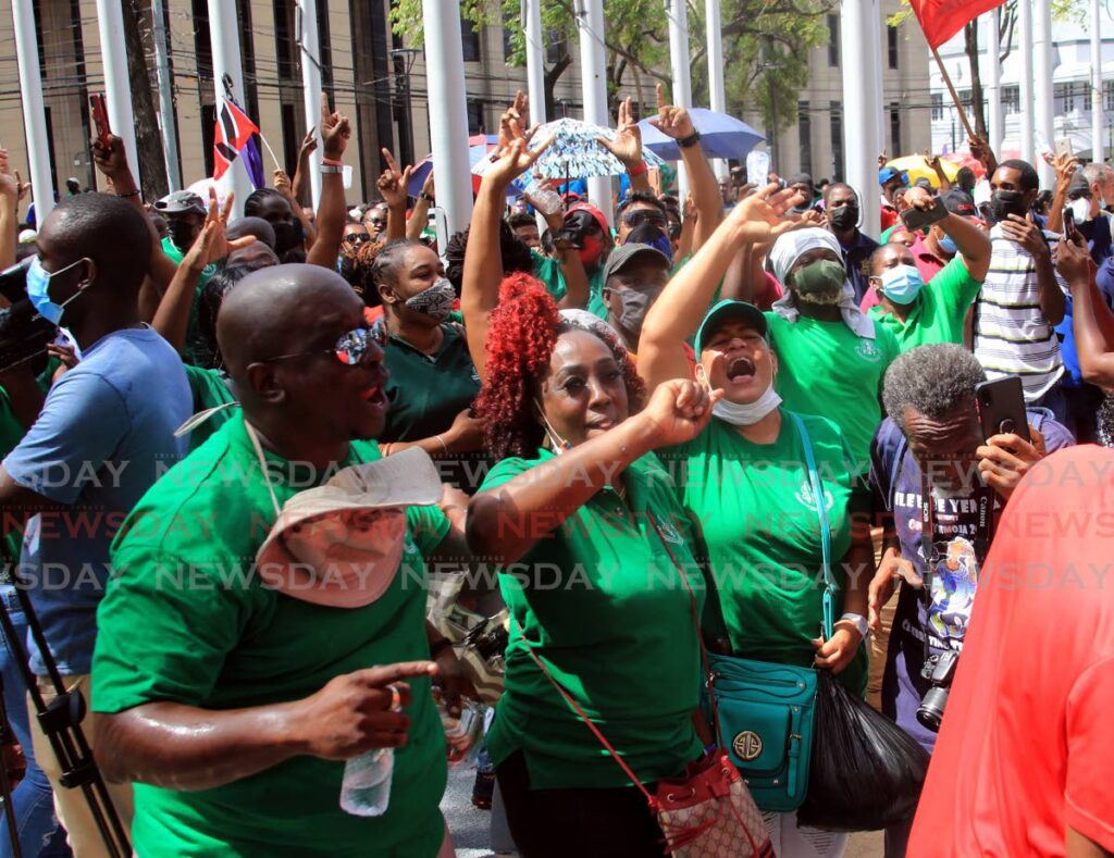 Public sector workers march on the streets of Port of Spain on Friday in protest against Government's two per cent over an eight-year period wage increase. - Sureash Cholai