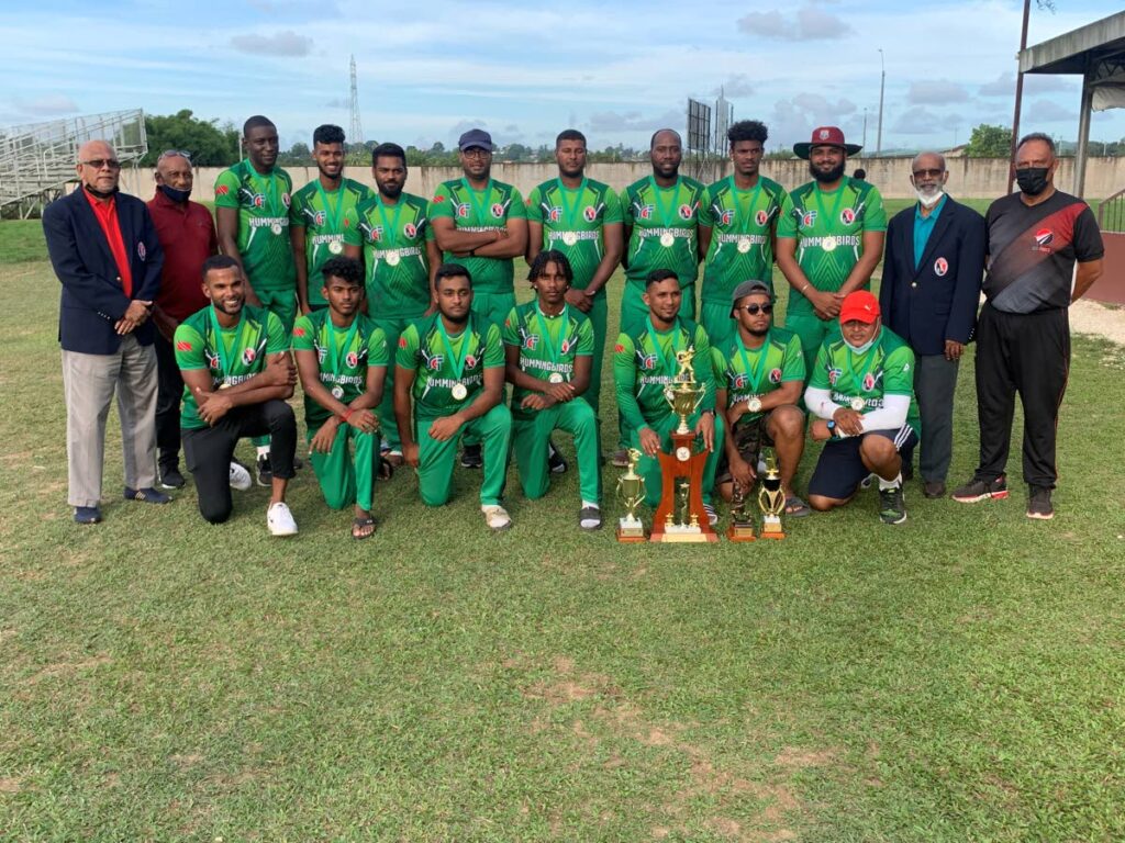 The Hummingbirds team with their awards, after they defeated Scarlet Ibis in the final of the Sports and Culture Fund 50-Overs Senior competition on Sunday, at the National Cricket Centre, Couva. Also in the photo are officials from the TTCB. PHOTO COURTESY TRINIDAD AND TOBAGO CRICKET BOARD. - 