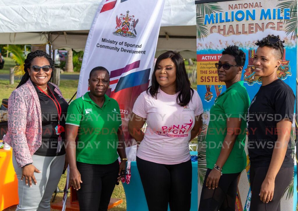 Minister of Sport Shamfa Cudjoe, centre, with representatives of sponsor First Citizens and Bafasports Ltd officials at the launch of the national million-mile challenge at Pigeon Point, Tobago, Tuesday. - David Reid