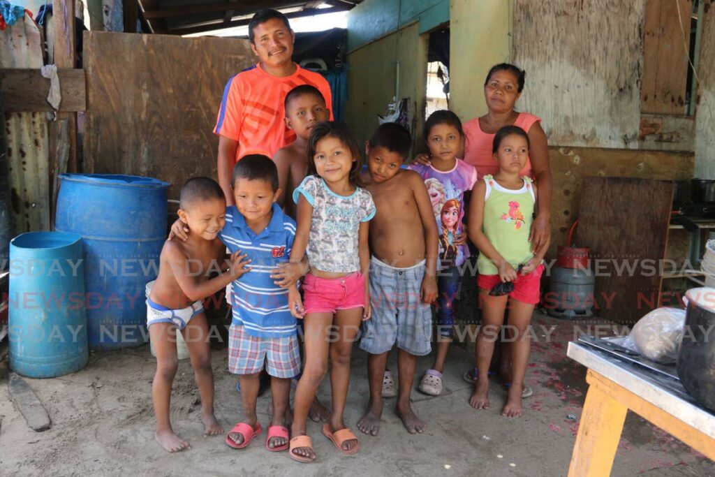 In this file photo, migrant children huddle at their family's home in Icacos, Cedros in 2020. - Marvin Hamilton