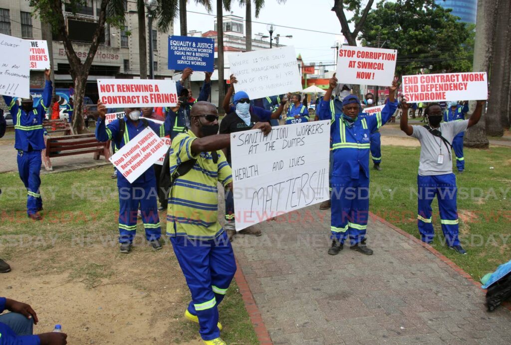 In this file photo, Workers of the Trinidad and Tobago Solid Waste Management Company Limited (SWMCOL) protest against several issues, including termination of contracts outside the company's head office on Independence Square, Port of Spain. Photo by Sureash Cholai