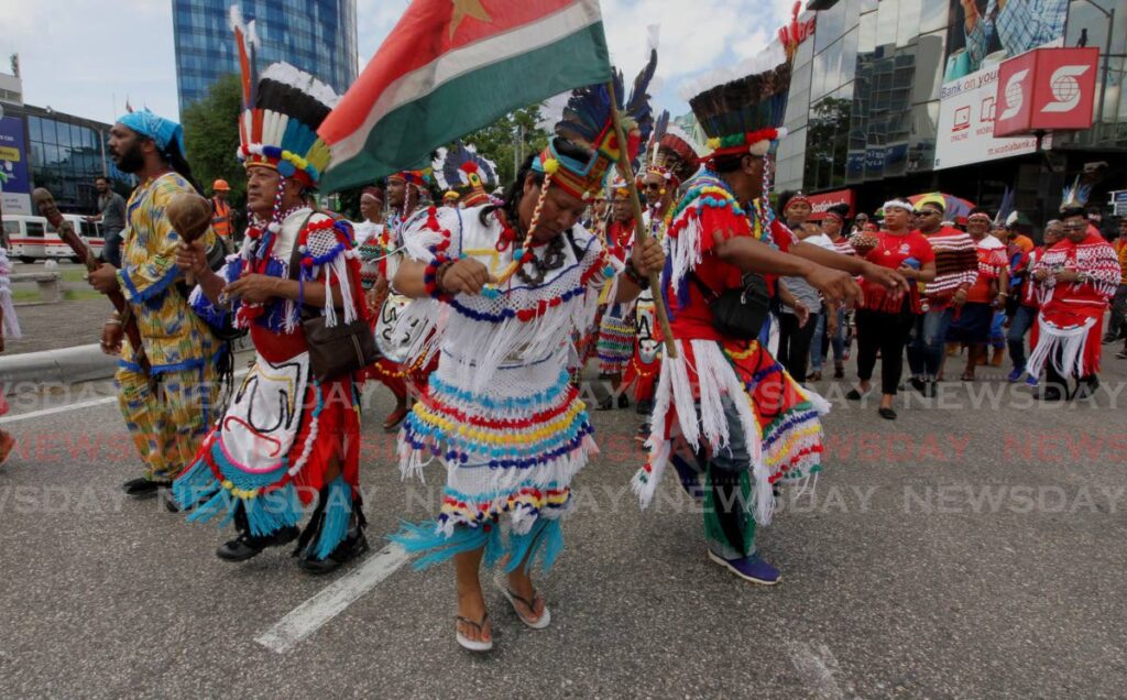 Ricardo Bharath, Chief of the Santa Rosa First Peoples Community, second from left, leads a march through Port of Spain, alongside indigenous groups from South and North America, to mark the anniversary of First Peoples Day on October 14. FILE PHOTO/ROGER JACOB