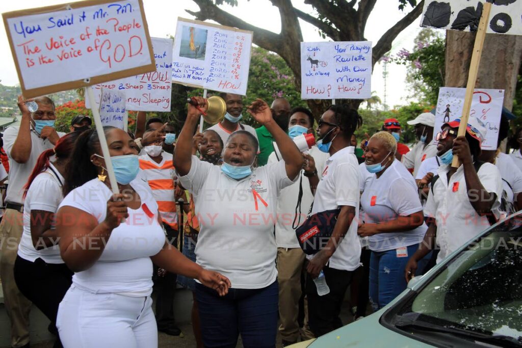 Public sector workers led by the National Trade Union Centre protest against the chief personnel officer's wage offer of two per cent over eight years in Port of Spain last Friday. - SUREASH CHOLAI