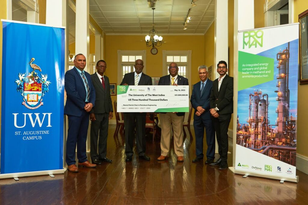 Ravi Cardinez (from left), chief financial officer at Proman for MHTL, Prof Andrew Jupiter, co-ordinator of petroleum studies and current holder of the Dennis Patrick Chair, Dr Euric Bobb, chairman of MHTL, Prof Brian Copeland, pro vice chancellor and principal of UWI St Augustine, Prof Raffie Hosein, head of the university's Chemical Engineering Department, and Enoch Ghany, programme graduate and maintenance engineer at Proman. Photo courtesy Proman. - 