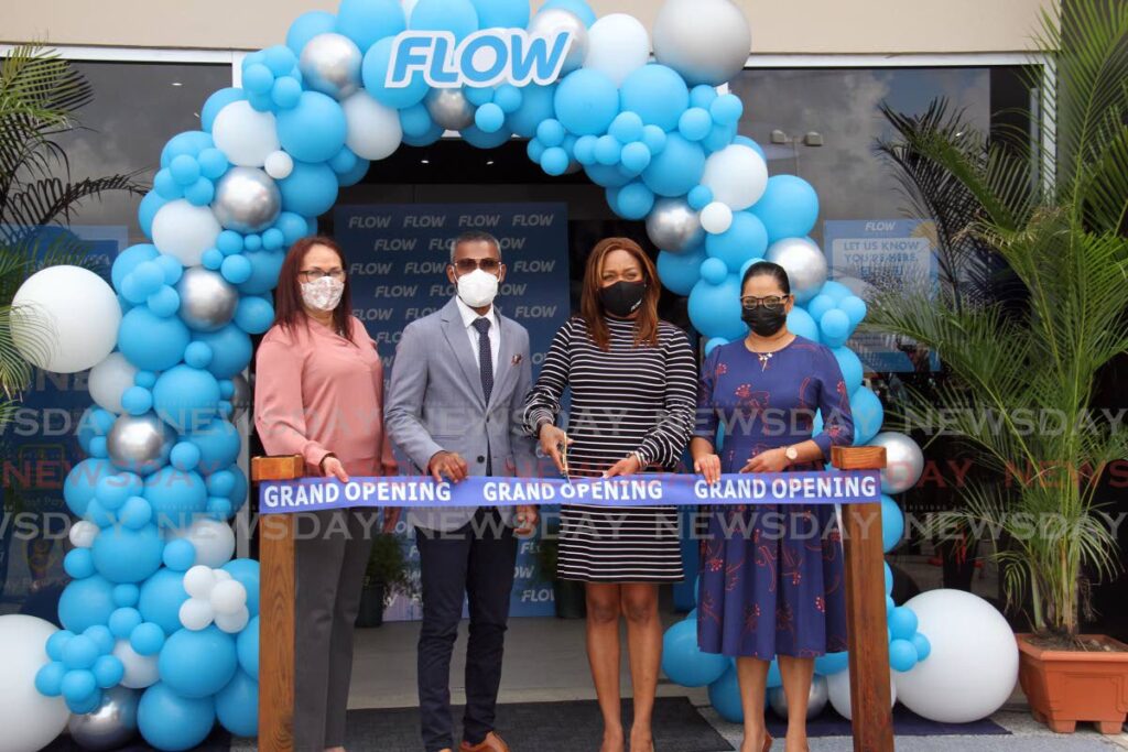 (From left) Roberta Norman-Reverand, director of Flow's Business-to-Consumer division, Chaguanas Mayor Faaiq Mohammed, Flow VP and general manager Simone Martin-Sulgan, and Chaguanas East MP Vandana Mohit at the opening of Flow's retail store at Price Plaza, Chaguanas on Wednesday. - Lincoln Holder