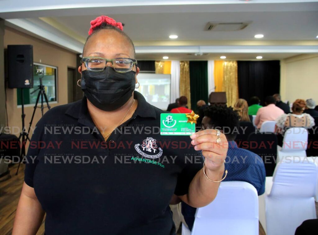 Deisha Chandler hold up her PSA Advantage Plus card which was launched on Wednesday evening by the Public Service Association at its Abercromby Street, Port of Spain office. - Photo by Sureash Cholai