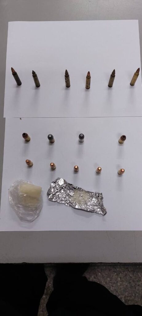 A quantity of ammunition and cocaine were found and seized at a house on Cascade Valley Road, Cascade, on Wednesday morning. 
The owner of the house ran away from the police but was found and arrested in the area a few hours later. 

PHOTO COURTESY TTPS - PHOTO COURTESY TTPS
