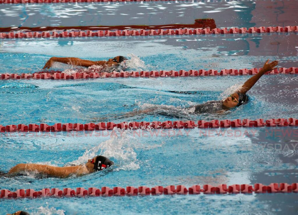 Puerto Rico’s Silva Contreras (R) takes the lead in the Pan American Age Group Aquatics Championships girls’ 200m medley, at the National Aquatics Centre, Couva, on Thursday. - Lincoln Holder