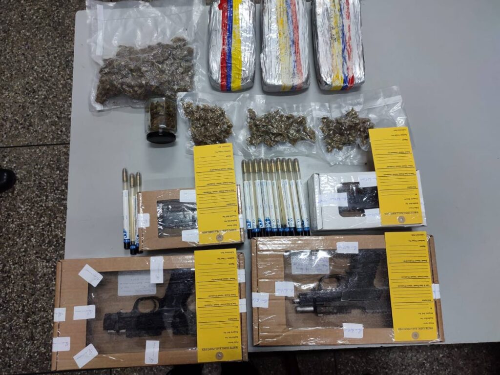 Two pistols and a quantity of marijuana were found and seized by police early on Friday morning in east Port of Spain and Belmont. PHOTO COURTESY TTPS - 