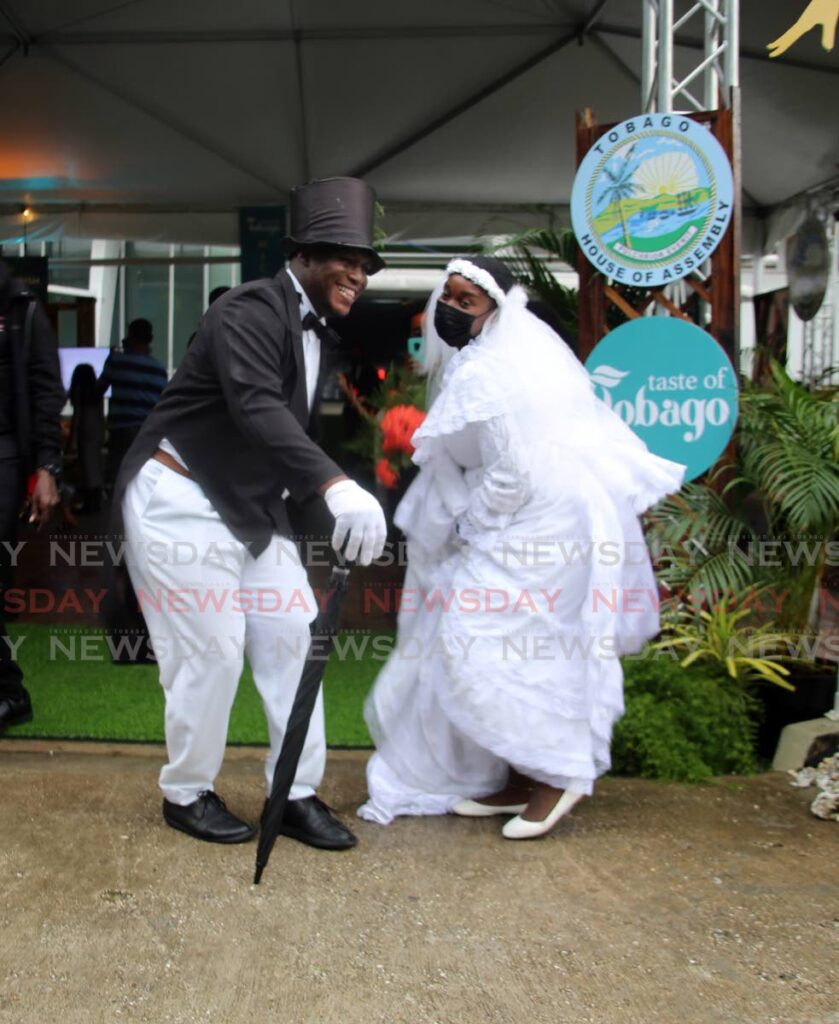 The Moriah Ole Time Wedding is reenacted by Leeei James and Chantal Augustine at a Taste Of Tobago micro-market in the Garden Theatre at Queen's Hall, Port of Spain, Friday. - SUREASH CHOLAI
