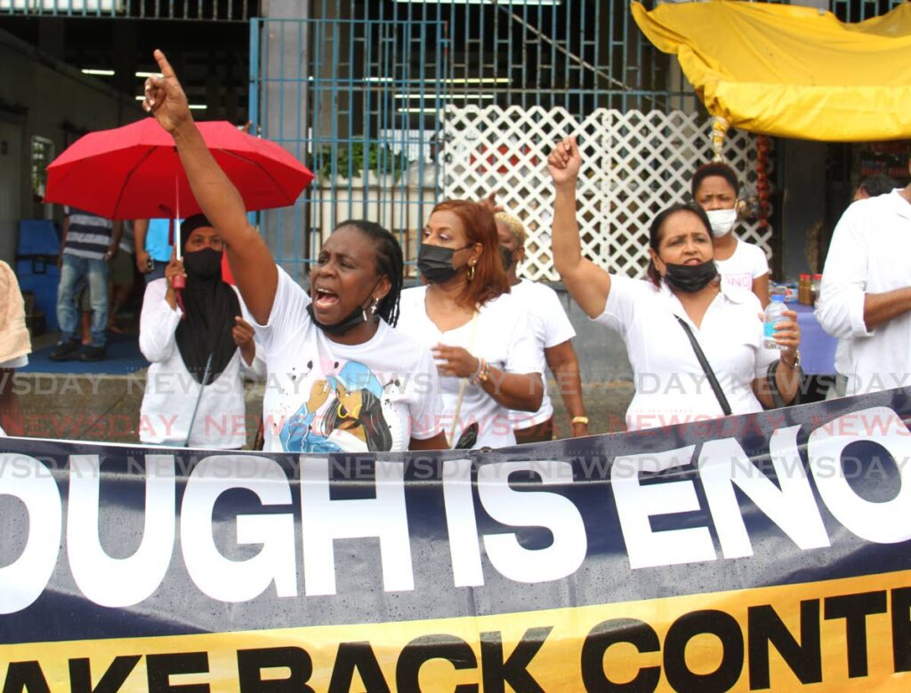 Participants in the UNC Women's Arm march in Arima on Saturday called for justice for women and children who are victims of abuse. - AYANNA KINSALE