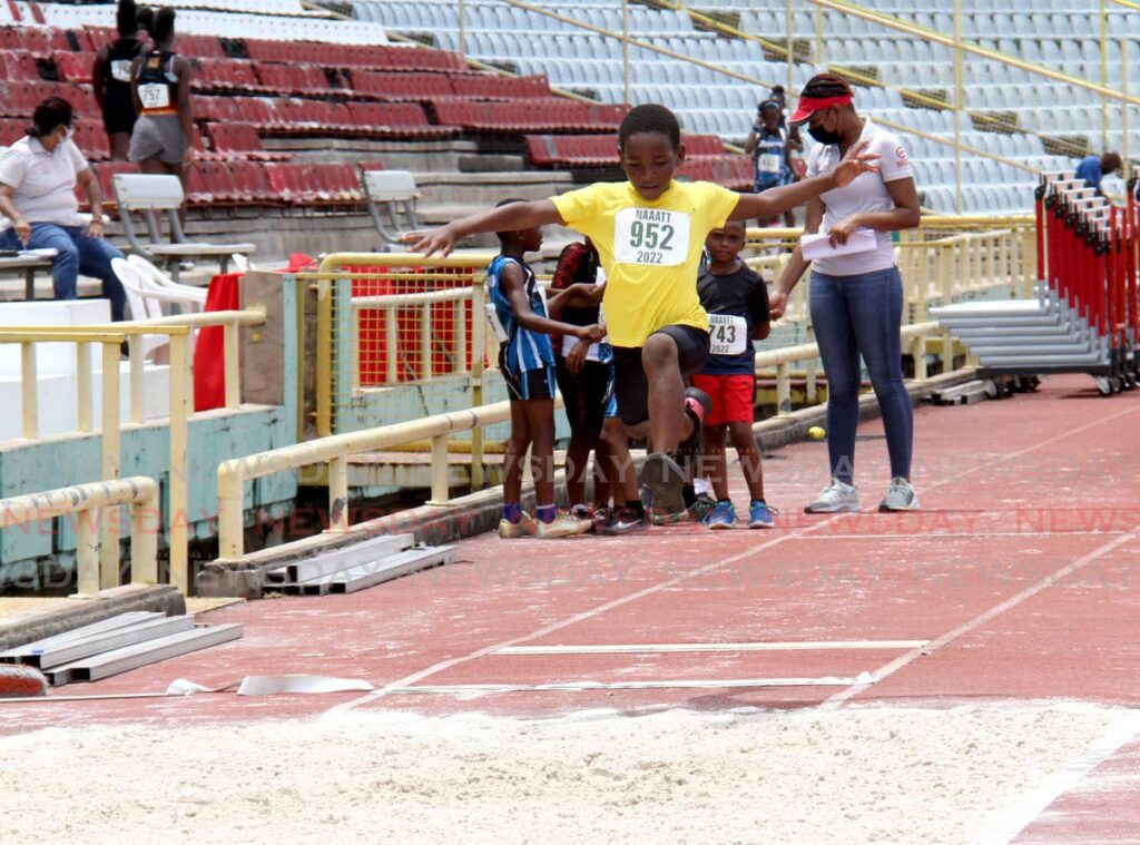 Kyron Garcia of Toco Tafac competes in the boys Under-9 long jump during the NGC/Republic Bank/NAAATT Juvenile Championships at the Hasely Crawford Stadium, Mucurapo on Saturday. - AYANNA KINSALE